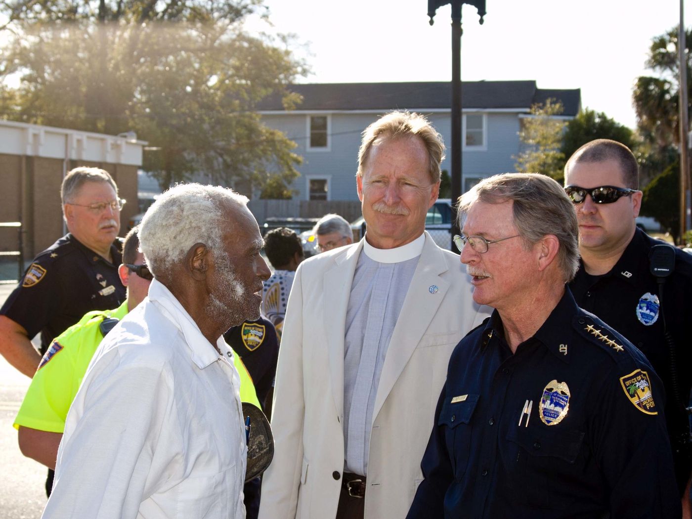 The Rev. Dr. Robert V. Lee III walking Jacksonville's Eastside with neighbors and police officers.