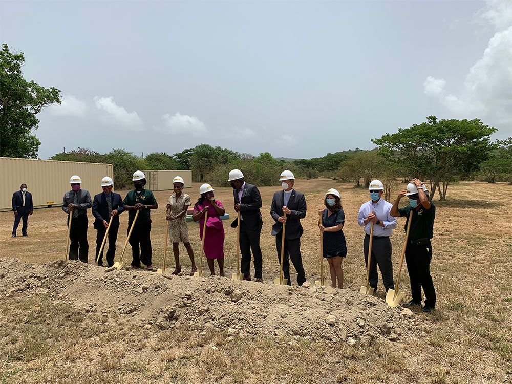 FreshMinistries and local partners breaking ground on a greenhouse site in the Caribbean.
