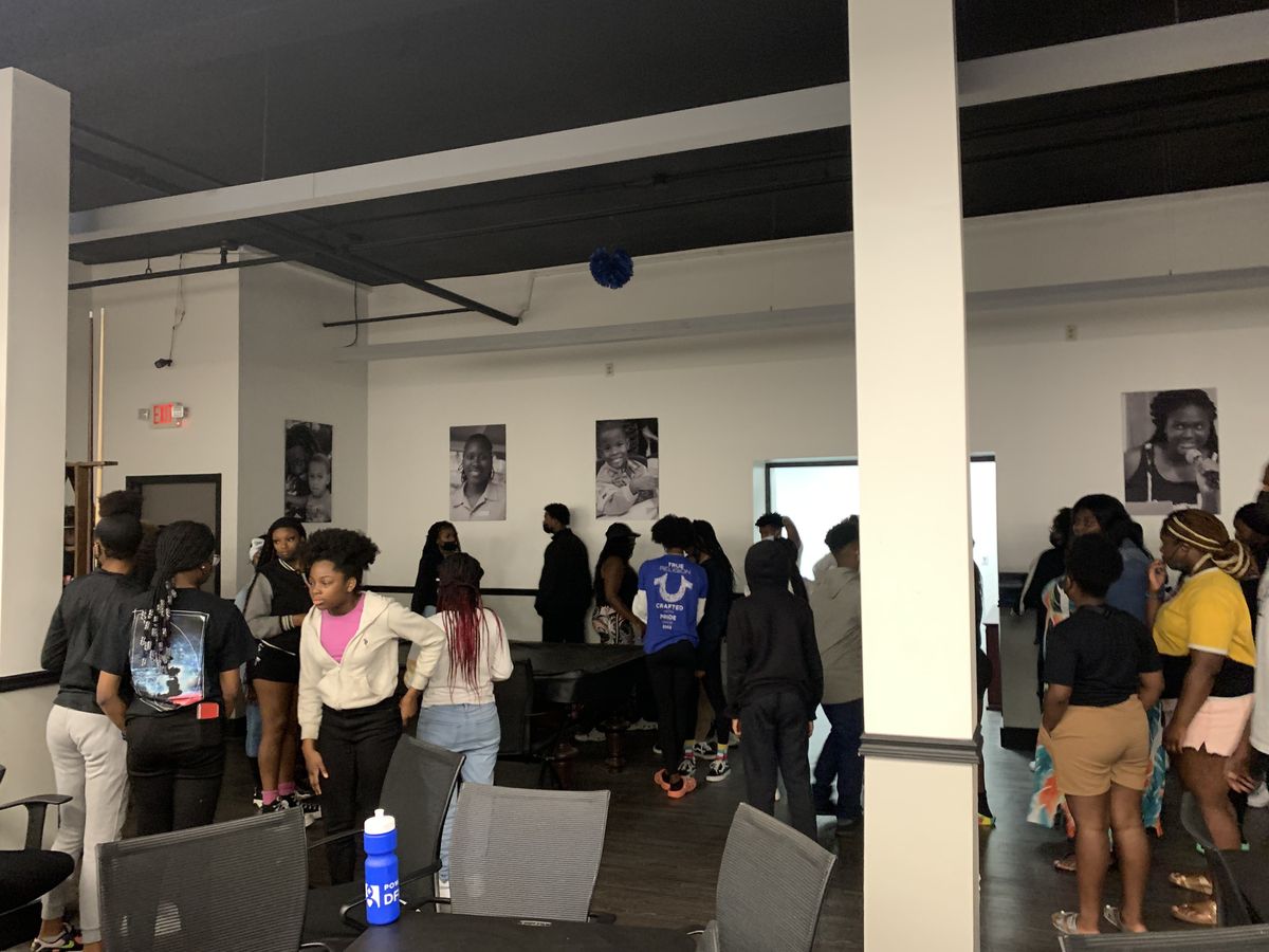 Families and young people in the community room at the Weaver Center