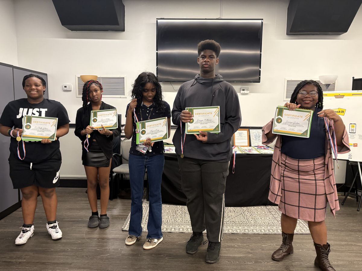 FreshFoundations students holding the certificates they earned