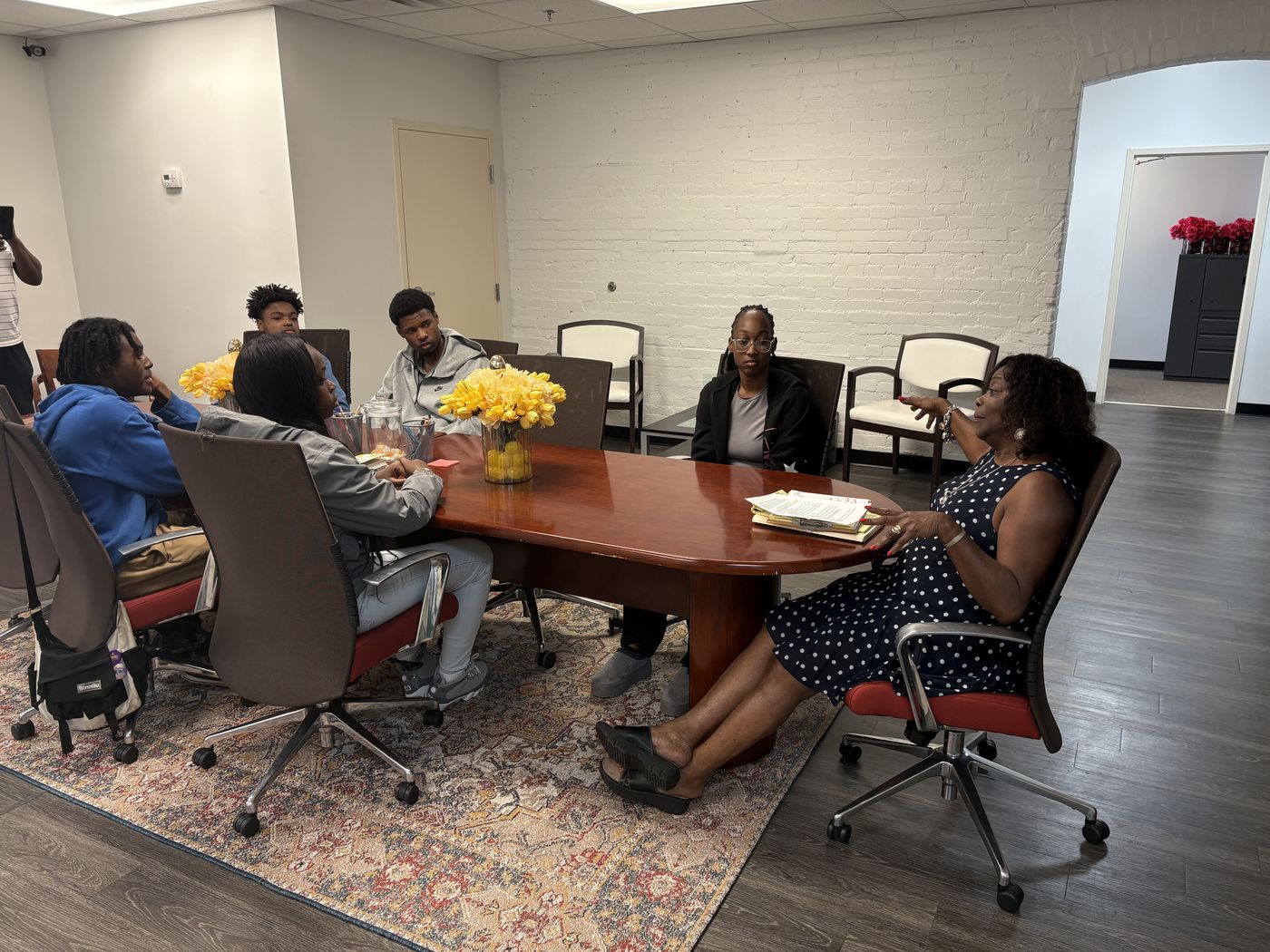 A FreshPath group mentoring session around the table at the Weaver Center