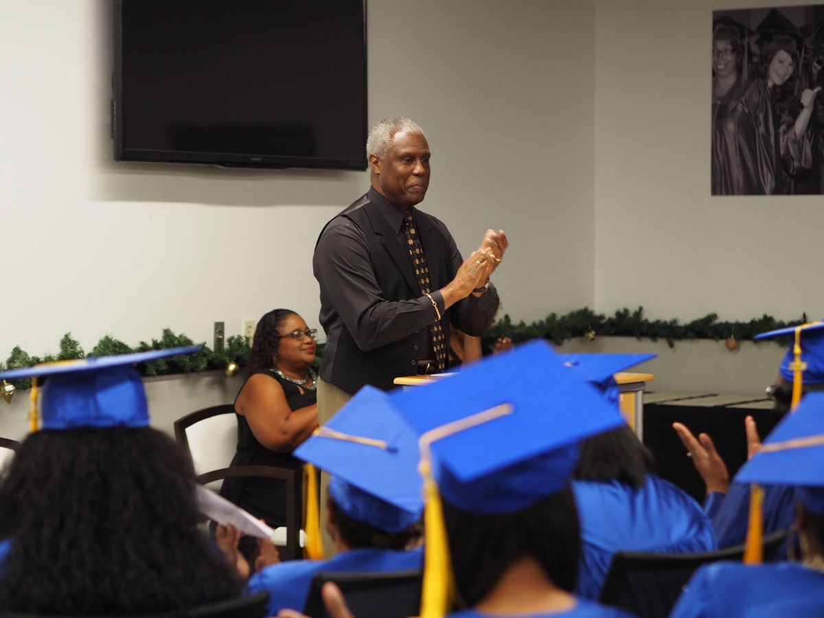 A speaker addressing the LifePoint graduating class