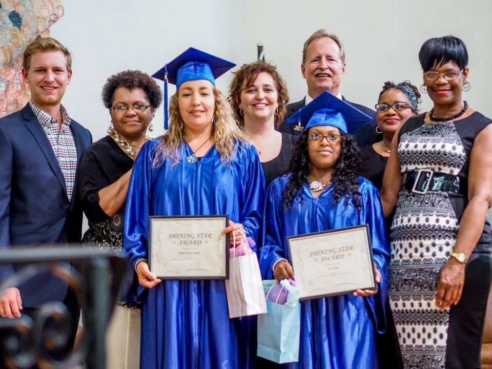 A LifePoint graduate receiving her certificate