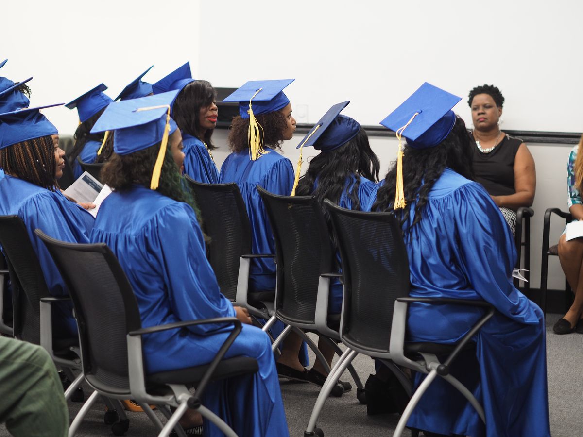 LifePoint graduates in their caps and gowns on graduation day