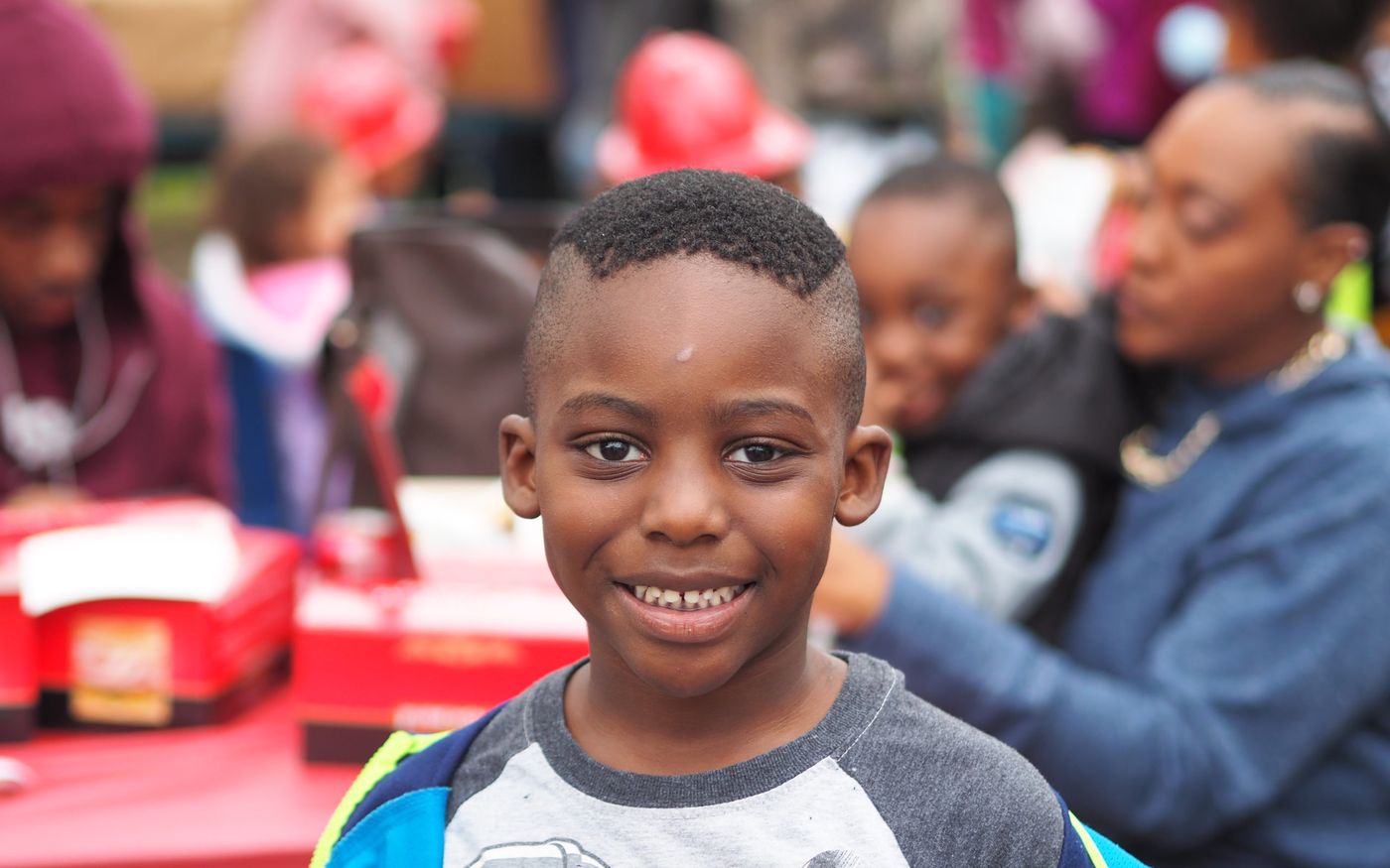 A young FreshFutures participant smiling at a FreshMinistries event.